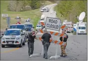  ?? AP photo ?? Authoritie­s set up road blocks at the perimeter of a crime scene, Friday.