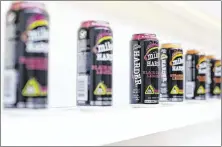  ?? PHOTOS BY KRISTEN NORMAN / CHICAGO TRIBUNE ?? A number of Mike’s Hard Lemonade cans are lined up at the company office in Chicago last month. The drink was the top-selling flavored malt beverage in the U.S. last year.
