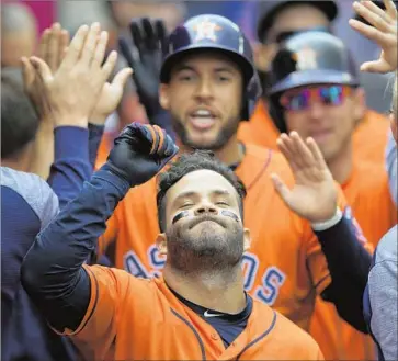  ?? Mark J. Terrill Associated Press ?? A GAME-CHANGING hit produced a head-turning moment for Houston’s Jose Altuve after the second baseman’s three-run home run gave the Astros a 4-2 lead in the third inning at Angel Stadium.