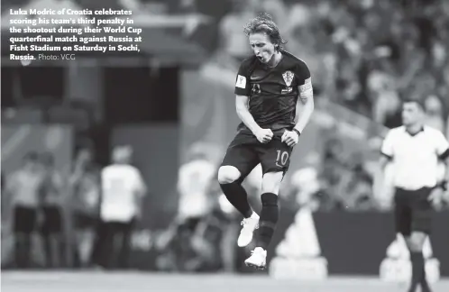  ?? Photo: VCG ?? Luka Modric of Croatia celebrates scoring his team’s third penalty in the shootout during their World Cup quarterfin­al match against Russia at Fisht Stadium on Saturday in Sochi, Russia.