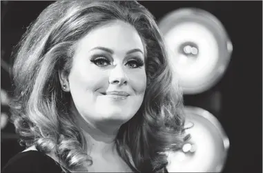  ?? DANNY MOLOSHOK/ REUTERS FILES ?? Adele will perform for the first time since having vocal cord surgery five months ago, when she takes the stage at the Grammy Awards show on Sunday. She is nominated for six awards, including album of the year for 21.