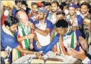  ?? HOCKEY INDIA ?? India hockey team cutting a cake with coach Graham Reid on the sidelines of sports ministry’s felicitati­on programme.
