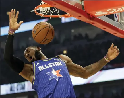  ?? NAM HUH — THE ASSOCIATED PRESS ?? LeBron James dunks during the first half of the NBA All-Star Game on Feb. 16in Chicago.