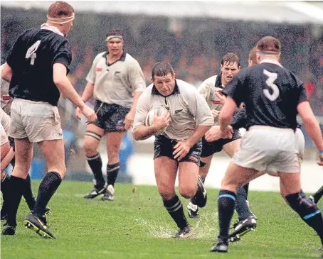  ?? PA/SNS. ?? Sean Fitzpatric­k, above, in action against Scotland in 1996; the current Scotland team, right, after their victory over Australia.