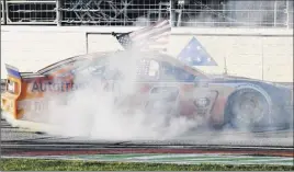  ?? John Amis / Associated Press ?? Brad Keselowski does a burnout after winning the 60th Annual Folds of Honor Quiktrip 500 at Atlanta Motor Speedway on Sunday.