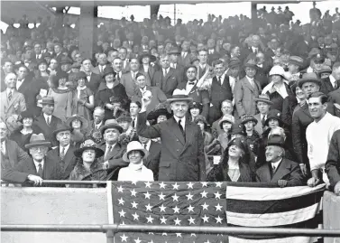  ?? AP Photo/File ?? ■ U.S. President Calvin Coolidge throws out the ball for the opening game of the 1924 World Series between the Washington Senators and the New York Giants on Oct. 4 in Washington.