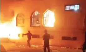  ?? Photograph: Twitter/@1500tasvir ?? A still from unverified footage showing a seminary that was set on fire in Izeh in western Iran during anti-government protests.