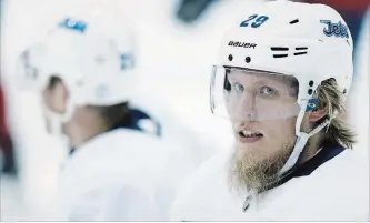  ?? CANADIAN PRESS FILE PHOTO ?? Jets right-winger Patrik Laine looks on during practice in Winnipeg on April 9 ahead of their opening playoff round against the Minnesota Wild. Laine will look like a new man by the weekend.