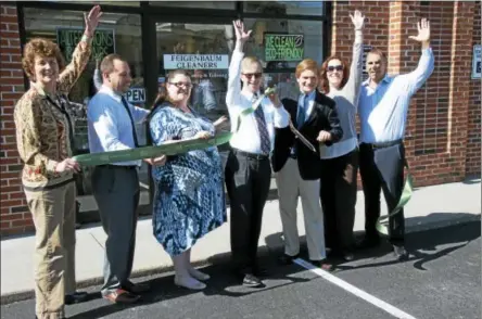  ?? PHOTO PROVIDED ?? Representa­tives from Feigenbaum Cleaners and the Saratoga County Chamber of Commerce celebrate the company’s 100-year anniversar­y and a grand opening for the new 18 Congress St. store in Saratoga Springs.