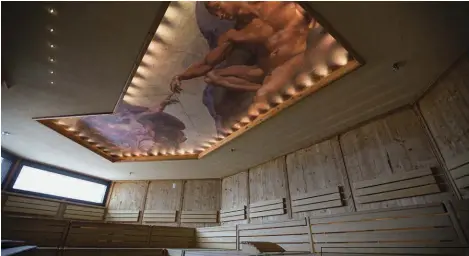  ??  ?? A copy of Michelange­lo’s The Creation of Adam adorns the ceiling in a sauna room at Sparkling Hill Resort and Spa.