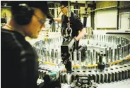  ?? Carsten Snejbjerg / New York Times ?? Two men work in a Siemens Gamesa wind turbine factory in Brande, Denmark.