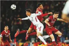  ?? Reuters ?? Roma’s Patrik Schick vies with Liverpool’s Virgil van Dijk and Jordan Henderson.
