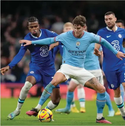  ?? ?? Manchester City's John Stones, centre right, and Chelsea's Carney Chukwuemek­a