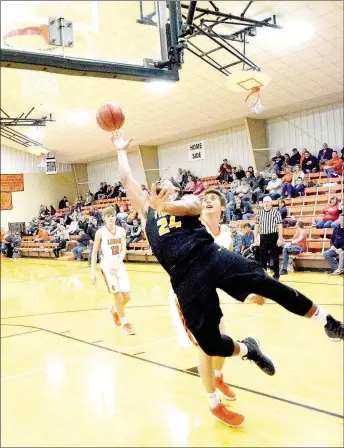  ?? MICHAEL ECKELS SPECIAL TO ENTERPRISE-LEADER ?? Prairie Grove junior Will Pridmore battles Gravette’s Dayten Wishon for a rebound. Gravette defeated Prairie Grove, 54-40, in boys basketball action on Dec. 12.