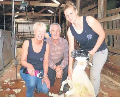  ??  ?? Shearing instructor Neil Mutch has been teaching students for 40 years. His students at Dalbog Farm included Sharon Gaston, left, and Morven Brown.
