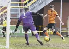  ??  ?? 0 Nicky Clark strokes home the winner for United on Saturday.