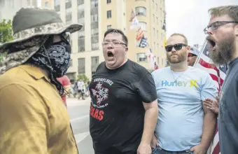  ??  ?? A group of mask-averse males protest against mandates to wear masks in Austin, Texas, U.S., June 28, 2020.