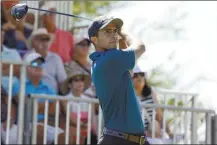  ?? AP photo ?? Alvaro Ortiz watches his tee shot on the first hole during Friday’s second round of the Mexico Open.