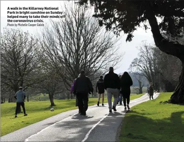  ?? Photo by Michelle Cooper Galvin ?? A walk in the Killarney National Park in bright sunshine on Sunday helped many to take their minds off the coronaviru­s crisis.