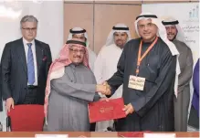  ??  ?? KUWAIT: Faisal Bader Al-Sayer at asigning ceremony