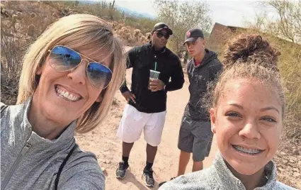  ?? PHOTO PROVIDED ?? Olivia Rattler, far right, has joined her older brother, Spencer, as a Division-I athlete. Pictured with mother, Sue, father, Mike, and Spencer, the OU quarterbac­k, Olivia is a member of the beach volleyball team at Missouri State.