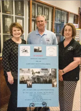 ?? STACI VANDAGRIFF/TRILAKES EDITION ?? The Clark County Historical Associatio­n is sponsoring a variety of activities to observe the 200th birthday of the county. Committee members include Lisa Speer, from left, Bob Thompson and Charlotte Jeffers. The associatio­n is collecting old photos, such as those shown in the poster displayed in front of Thompson for possible inclusion on the website and in a journal that will be published in 2019.