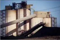  ?? CP FILE PHOTO ?? A conveyor belt transports coal at the Westmorela­nd Coal Company’s Sheerness Mine near Hanna in this December 2016 file photo.