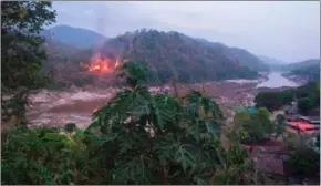  ?? KAWTHOOLEI TODAY/AFP ?? The KNU’s Fifth Brigade on Tuesday attacked and razed an army base right by the Salween River – which demarcates a border between Thailand and Myanmar – and the military retaliated with air offensives.