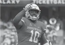  ?? Tim Warner / Contributo­r ?? Cougars defensive tackle Ed Oliver will see action as a running back as part of a Heisman Trophy push for the talented junior.