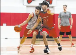  ?? Erik Verduzco Las Vegas Review-journal ?? UNLV coach Kevin Kruger wants to see Jordan Mccabe, left, and the offense be more aggresive on the team’s threegame exhibition swing through Canada.