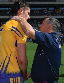  ??  ?? Wexford manager Davy Fitzgerald congratula­ting Conor Cleary after his native Clare prevailed in Cork on Saturday.