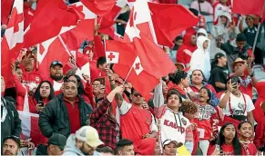  ?? GETTY IMAGES ?? Tongan fans created a sea of red at Eden Park as they cheered their team to a historic win over Australia last weekend.