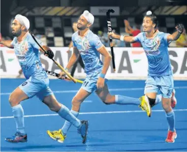  ?? AFP ?? Simranjeet Singh (left) celebrates scoring the second goal against Belgium during their World Cup Pool C match on Sunday.