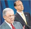  ?? BRENDAN SMIALOWSKI/AFP/GETTY IMAGES ?? Deputy Attorney General Rod Rosenstein, right, listens to Attorney General Jeff Sessions at a Department of Justice meeting in August.