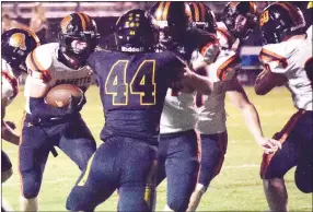  ?? Westside Eagle Observer/MIKE ECKELS ?? After receiving a handoff from Lion quarterbac­k Rhett Hilger, Kyler Austin finds an opening in the Tiger defensive line and runs toward it during the Friday night conference showdown between the Prairie Grove Tigers and the Gravette Lions in Prairie Grove.