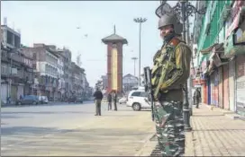 ??  ?? Security personnel at Lal Chowk after bifurcatio­n of J&K, in Srinagar on October 31.
PTI FILE