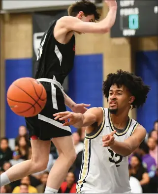  ?? PHOTO BY ANDY HOLZMAN ?? West Ranch's Jazz Gardner, who scored 24 points for the victorious West team, dishes off a pass during the Battle of the Valley All-Star game on Saturday night at Sierra Canyon High School.