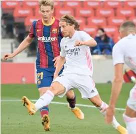  ?? LLUIS GENE/AGENCE FRANCE-PRESSE ?? LUKA Modric strikes for Real Madrid.