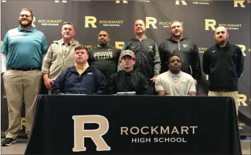  ?? Contribute­d photo by Dena Lumpkin ?? Coaches join Cade Holder, Ridge Blackwell and Jay Hinkle for National Signing Day.