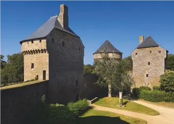  ??  ?? Fig 1 below: The interior of the castle with its ancient holly tree. Fig 2 right: The castle stands on a rock, above a wide pool, at one end of the village