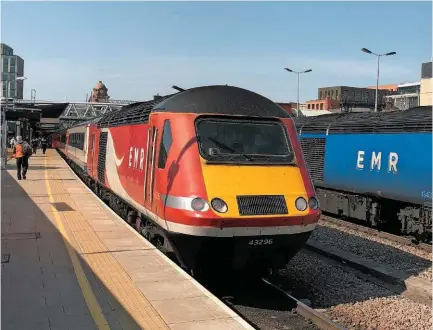  ?? CHRIS MCGEADY. ?? Two types of East Midlands Railway HST sets stand at the country end of Nottingham station on September 14 2020. The train on the left will form the 1245 service to St Pancras Internatio­nal, while the train on the right will depart as empty coaching stock to Sheffield at 1216. The National Infrastruc­ture Commission favours investment in existing city centre stations such as this, which do not lie on the proposed route of HS2 Phase 2b.