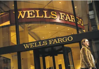  ?? Victor J. Blue / Bloomberg ?? A new suit alleges Wells Fargo sales staff targeted immigrants in the country illegally in their push to drive up the number of new accounts opened, adding to the bank’s existing scandal.