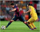  ?? GETTY IMAGES ?? Cillian Sheridan challenges Lionel Messi in a 2014 Champions League match.