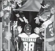  ?? Elise Amendola Associated Press ?? FANS congratula­te Boston Bruins right wing David Pastrnak (88) after his four-goal performanc­e.