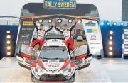  ??  ?? Elfyn Evans and co-driver Martin Scott of Britain celebrate winning last weekend’s Rally Sweden.