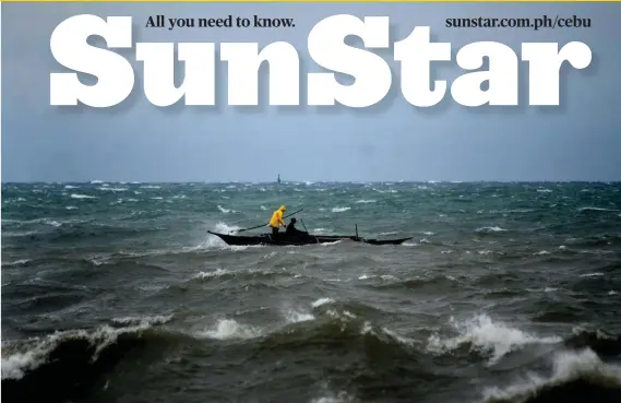  ?? SUNSTAR FOTO / ALAN TANGCAWAN ?? STORM BREWING. Fishermen battle big waves off the South Road Properties in Cebu City ahead of the arrival of Typhoon Ompong (Mangkhut), which has already disrupted inter-island travel, stranding passengers in terminals.