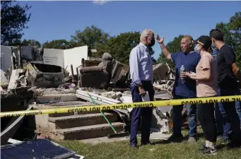  ?? Ap file ?? BLOWN AWAY: President Biden talks with a family whose home was destroyed by Hurricane Ida.
