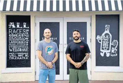  ?? SUSAN STOCKER/SOUTH FLORIDA SUN SENTINEL ?? Co-owners Nicolas Riveira, left, and David Lopez at Sidewalk Bottle Shop, opening soon in the Progresso neighborho­od of Fort Lauderdale.