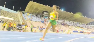  ??  ?? Gladstone Taylor/Multimedia photo editor Bridget Campbell of St Jago enters the first bend on the final leg of the women’s 4x400 metre open at the Queen’s/Grace Jackson Invitation­al Meet 2019, held at the National Stadium on Saturday January 26.