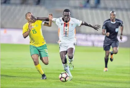  ??  ?? Andile Jali of South Africa and Brian Mwila of Zambia. Photo: Lefty Shivambu/Gallo Images